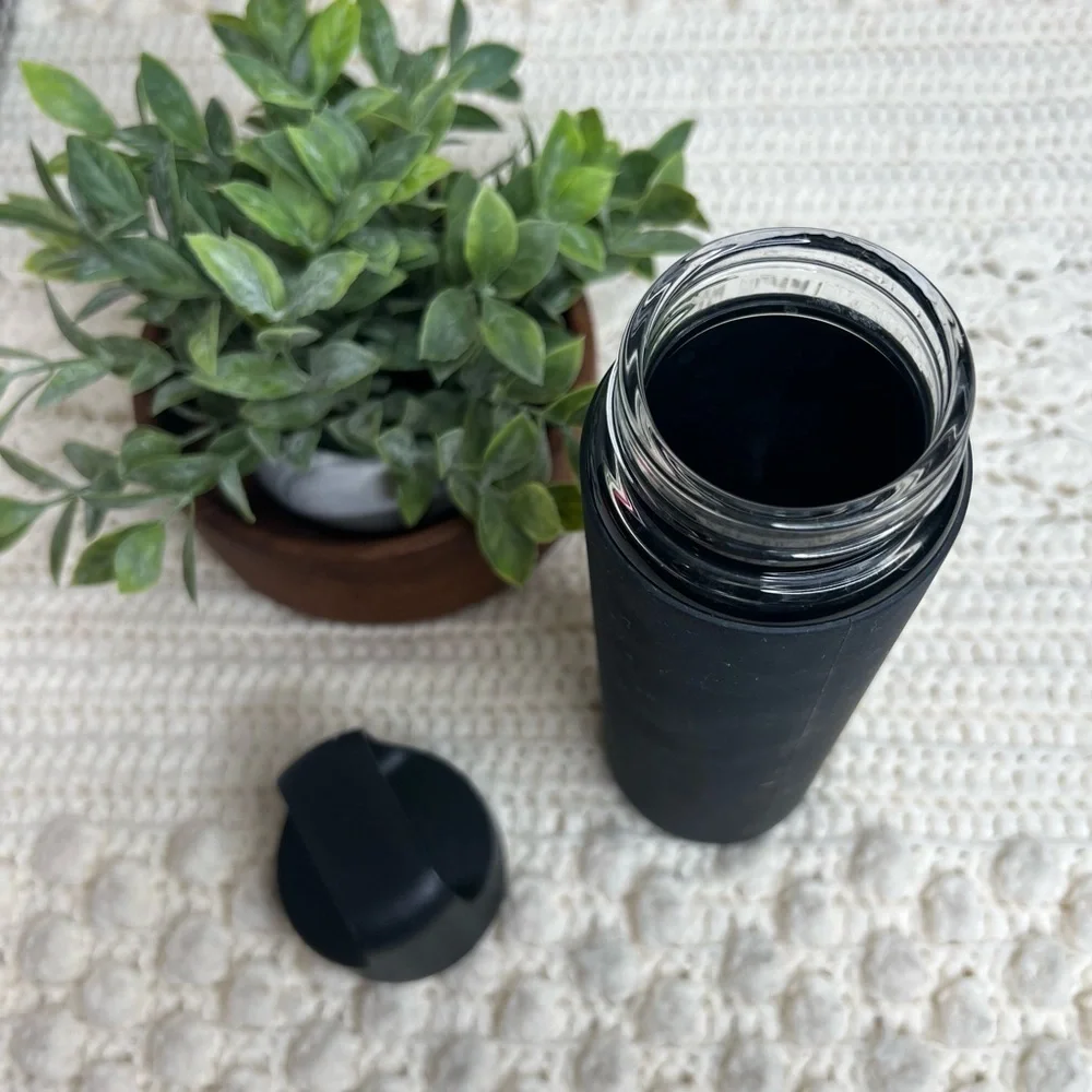 PELOTON Workout Glass Water Bottle with Lid Silicone Sleeve Black Logo